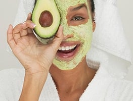 Woman using a facial mask
